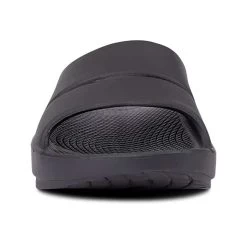 OOfos Unisex OOahh Slide - Black-Regular (D) -Shoe Zone Shop 1100BLK shot3 932x680 00bd8db1 1e6b 4cb5 9af6 228b8734257b